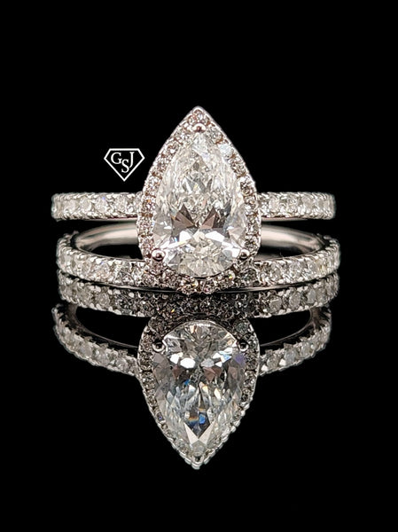 14K gold wedding set features a 1.17CT pear shaped center diamond