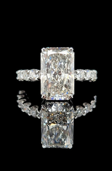 Check out this emerald cut 4.12 carat centre stone Diamond engagement ring.