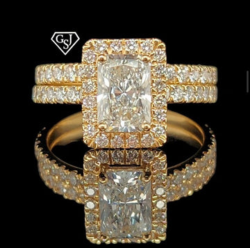 14K Gold and features a dazzling 1.18CT Emerald-Cut diamond