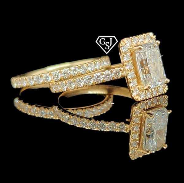 14K Gold and features a dazzling 1.18CT Emerald-Cut diamond