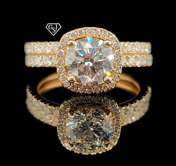features a stunning 1.26CT center stone! Set in 14K Gold, this set is sure to impress