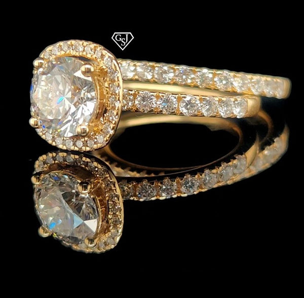 features a stunning 1.26CT center stone! Set in 14K Gold, this set is sure to impress