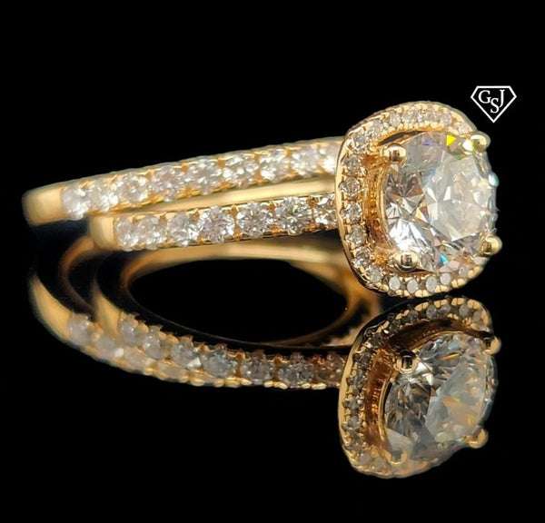 features a stunning 1.26CT center stone! Set in 14K Gold, this set is sure to impress