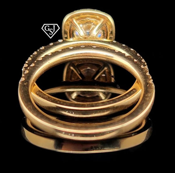features a stunning 1.26CT center stone! Set in 14K Gold, this set is sure to impress