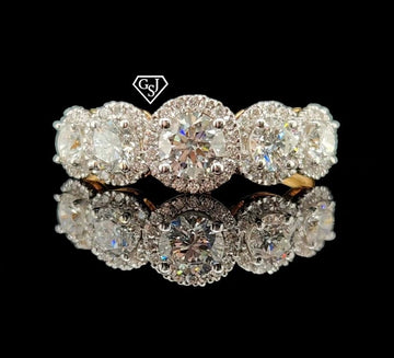 five stones in the center of the cluster total 0.91CTs on their own, and each larger stone has a halo of smaller diamonds for maximum sparkle