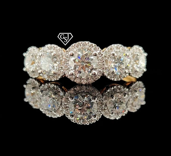 five stones in the center of the cluster total 0.91CTs on their own, and each larger stone has a halo of smaller diamonds for maximum sparkle