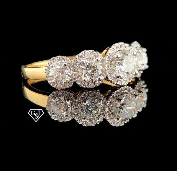 five stones in the center of the cluster total 0.91CTs on their own, and each larger stone has a halo of smaller diamonds for maximum sparkle