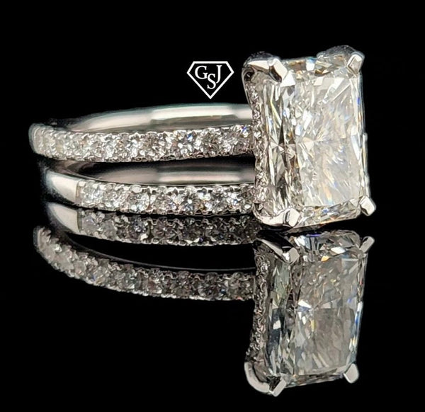 14K wedding set features a gorgeous 2.09CT Emerald Cut Diamond