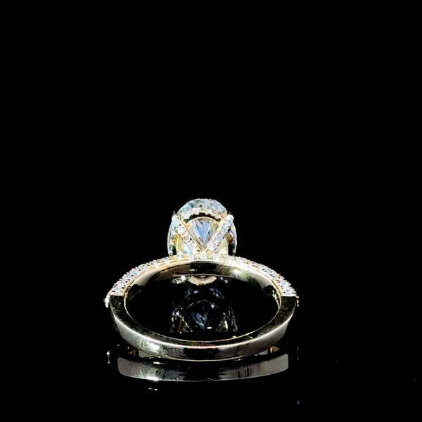 “Feast your eyes on this stunning 3.87 carat total diamond weight lab-grown Oval diamond engagement ring. Set in luxurious 18kt yellow gold, this show-stopper is guaranteed to turn heads at any occasion.”