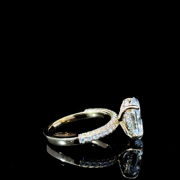 “Feast your eyes on this stunning 3.87 carat total diamond weight lab-grown Oval diamond engagement ring. Set in luxurious 18kt yellow gold, this show-stopper is guaranteed to turn heads at any occasion.”